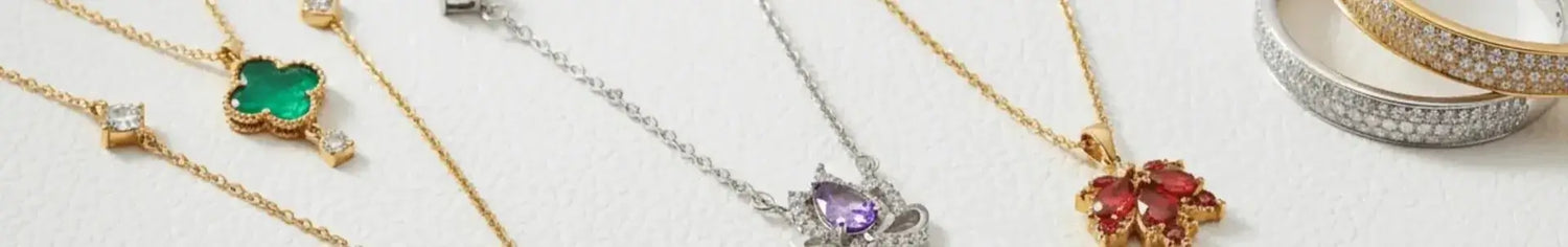 Collection of necklaces with gemstones on a light background